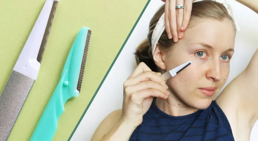 Dermaplaning for men: A woman uses a facial razor, similar to those used for dermaplaning, to exfoliate her skin.