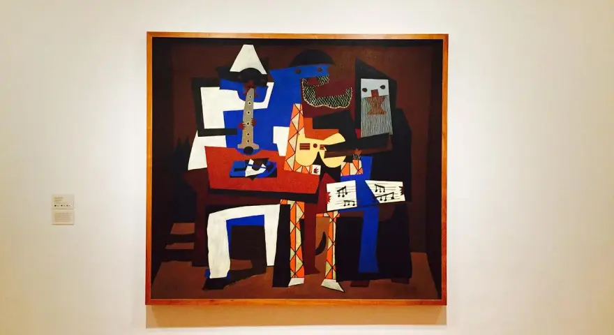 En målning i Picasso stil föreställer musiker med instrument.