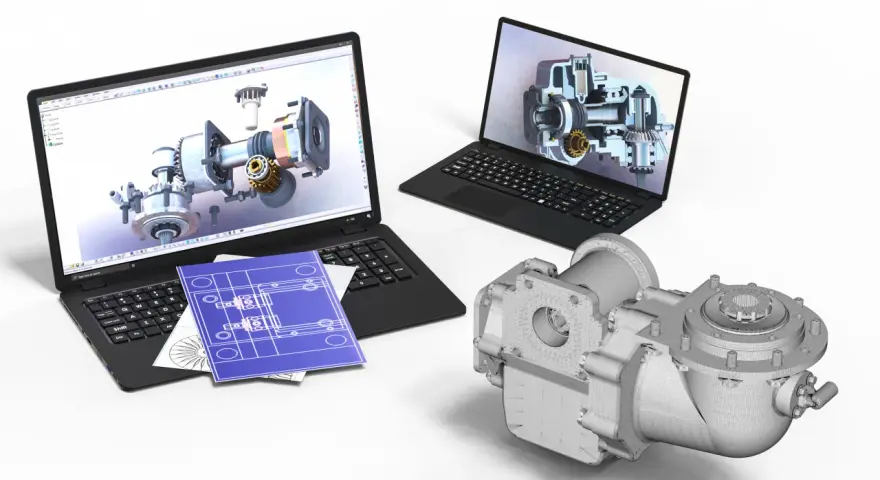 Dwa laptopy z wizualizacjami 3D mechanizmów, niebieskie plany i model części. To efekt pracy z programem cad skrót.