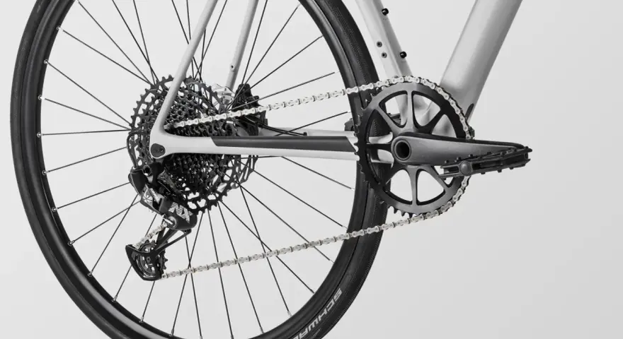 Close-up of a modern MTB drivetrain, featuring a SRAM rear derailleur, a wide-range cassette, and a single-chainring crankset.