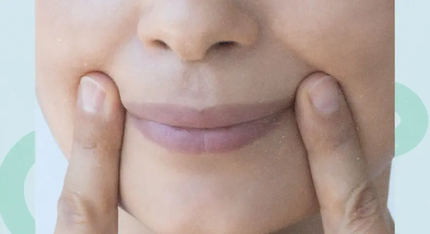 Fingers press into the cheeks, creating dimples. Could this be one of the unexpected side effects of face yoga?