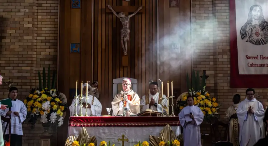 Clergy at an altar during a religious service. The length of vigils can vary, but this scene captures a moment of solemnity.