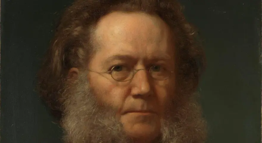 Porträtt av Henrik Ibsen med sitt karaktäristiska skägg och glasögon. Hans blick är intensiv och tankfull.