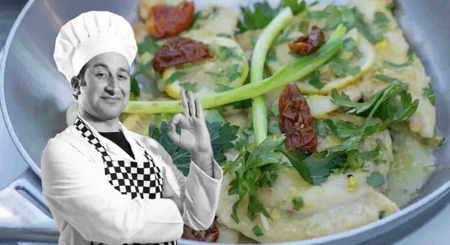 Chef approva scaloppine al limone cremose, un piatto invitante con limone, pomodori secchi e prezzemolo.