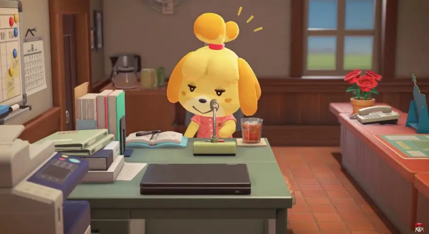 Isabelle, la perrita de Animal Crossing, habla por un micrófono en su escritorio.