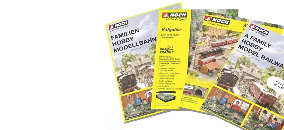 Broschüren für die Faszination Modellbau: Familien Hobby Modellbahn und A Family Hobby Model Railway, mit detaillierten Anlagen und Anleitungen.
