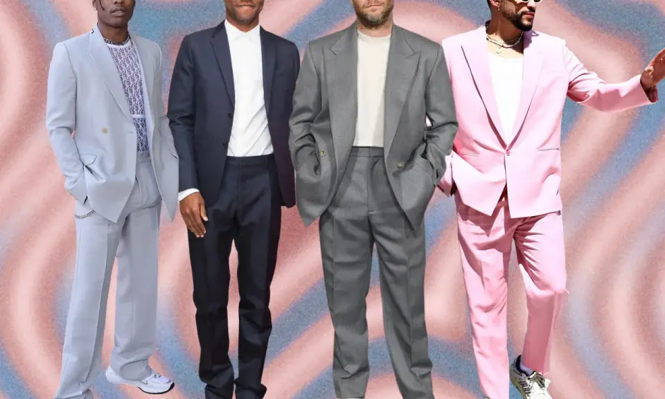 Four men in stylish suits with sneakers. A$AP Rocky in a light blue suit, Frank Ocean in a dark suit, Seth Rogen in a grey suit, and Bad Bunny in a pink suit.