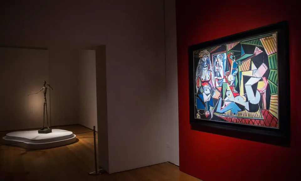 A museum gallery showcases Picasso's "Les Femmes d'Alger" alongside a slender bronze sculpture.