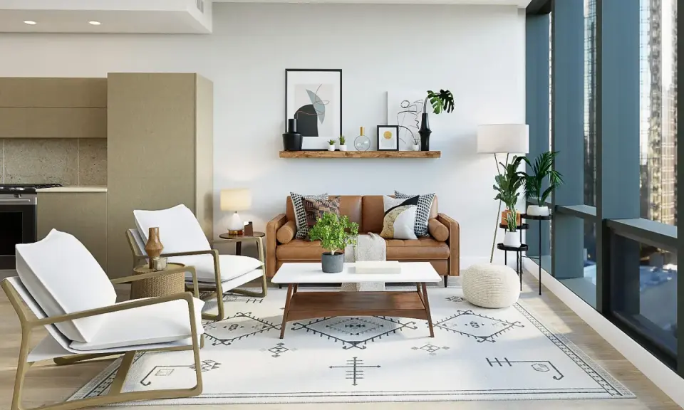 Salón moderno con sofá de cuero, sillones blancos y alfombra geométrica. Dos focos empotrados sin falso techo iluminan la estancia.