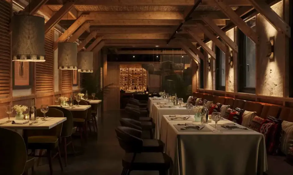 Ambiente acogedor de parrilla argentina nuevos aires. Mesas puestas, vigas de madera y luces cálidas invitan a disfrutar.