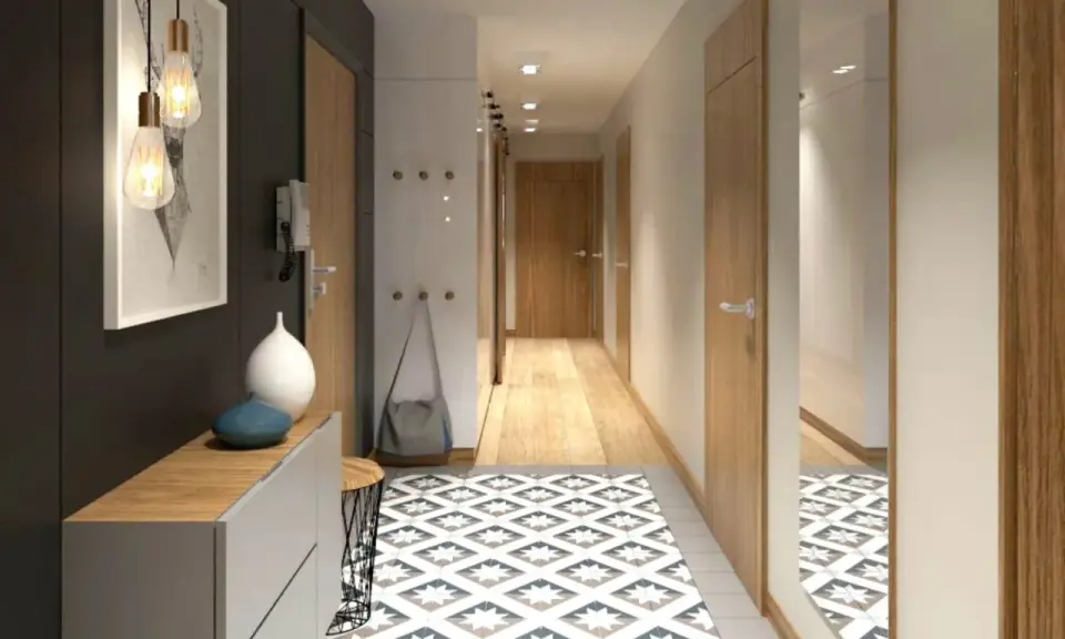 Un corridoio stretto con idee di design moderne: tappeto geometrico, mobili minimalisti, luci a sospensione e specchio a tutta altezza.
