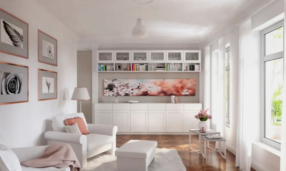 Ein helles Wohnzimmer mit weißem Sofa, Sessel, Bücherregal und Kirschblüten-Kunstwerk. Modernes **interior design** mit viel Licht.