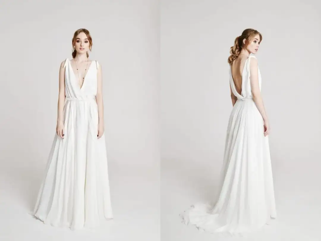 Piękna, zwiewna suknia ślubna z głębokim dekoltem i odkrytymi plecami. Zastanawiasz się, ile kosztuje uszycie sukni ślubnej u krawcowej?