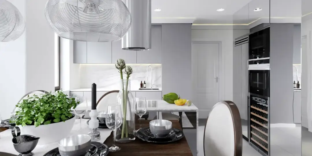 Nowoczesna kuchnia z jadalnią, gdzie subtelne listwy sufitowe led podkreślają elegancję wnętrza.