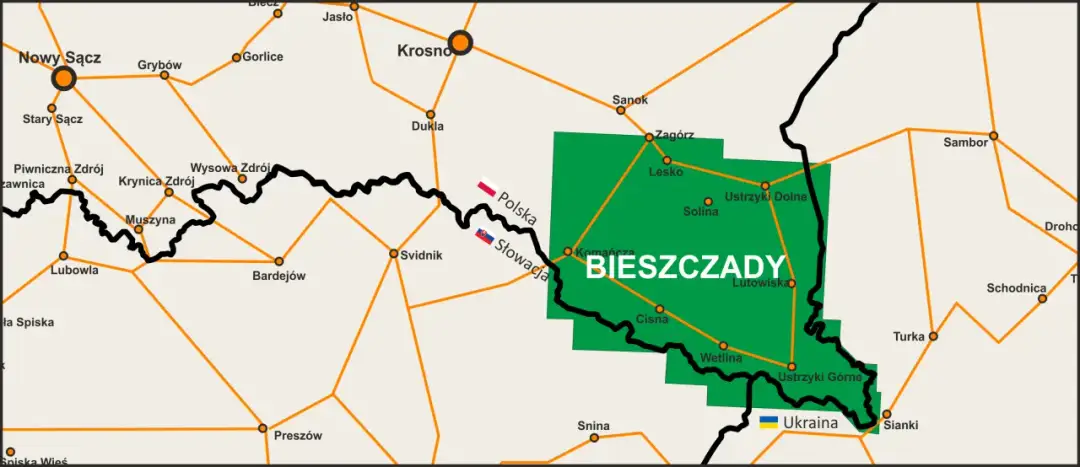 Mapa pokazuje, gdzie są Bieszczady, zaznaczone zielonym obszarem. Widać pobliskie miasta jak Sanok, Ustrzyki Dolne, Lesko, Cisna i Wetlina.