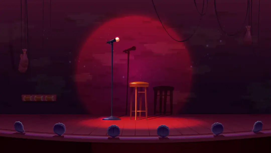 Scena klubu komediowego z mikrofonami i stołkami. Zastanawiasz się, ile zarabia stand-uper?