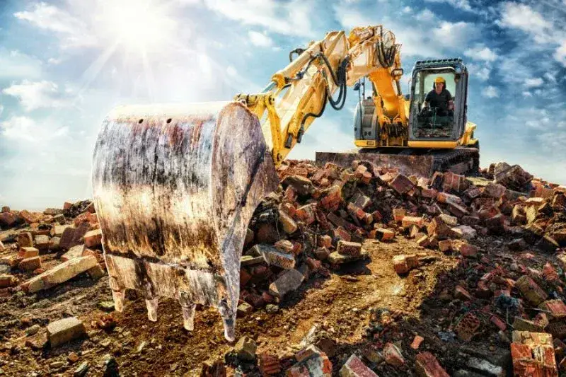 Ile zarabia operator koparki w Szwajcarii? Zaskakujące fakty i różnice