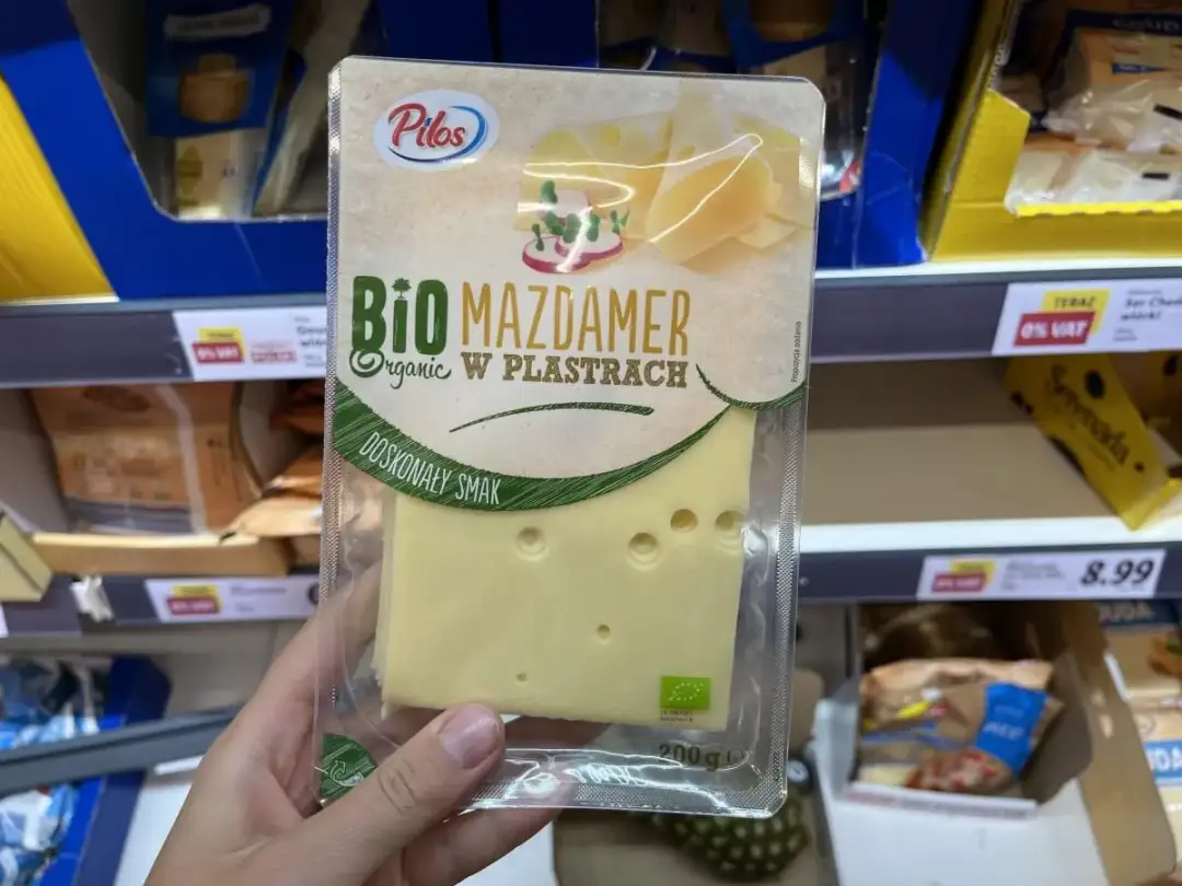 Opakowanie sera Mazdamer Bio w plastrach, promowane jako najzdrowszy ser żółty, z widocznym logo ekologicznym.