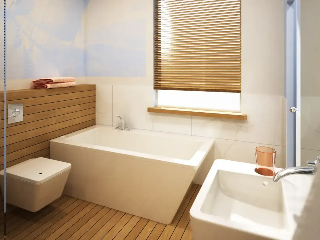 Nowoczesna łazienka z wanną i umywalką. Czy w budynku gospodarczym może być łazienka? Tak, jak widać na zdjęciu, można stworzyć komfortową przestrzeń.