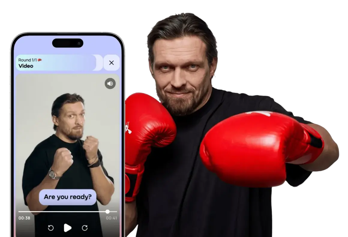 A boxer in red gloves, ready to throw down. The phone screen shows a video with the text "Are you ready?" - a real knockout!