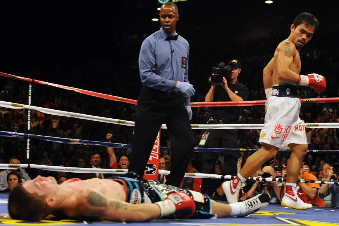A boxer lies on the canvas as the referee stands over him. The victor, Manny Pacquiao, walks away, his red glove raised. Can you push in boxing? Yes, this is the result of a powerful punch.