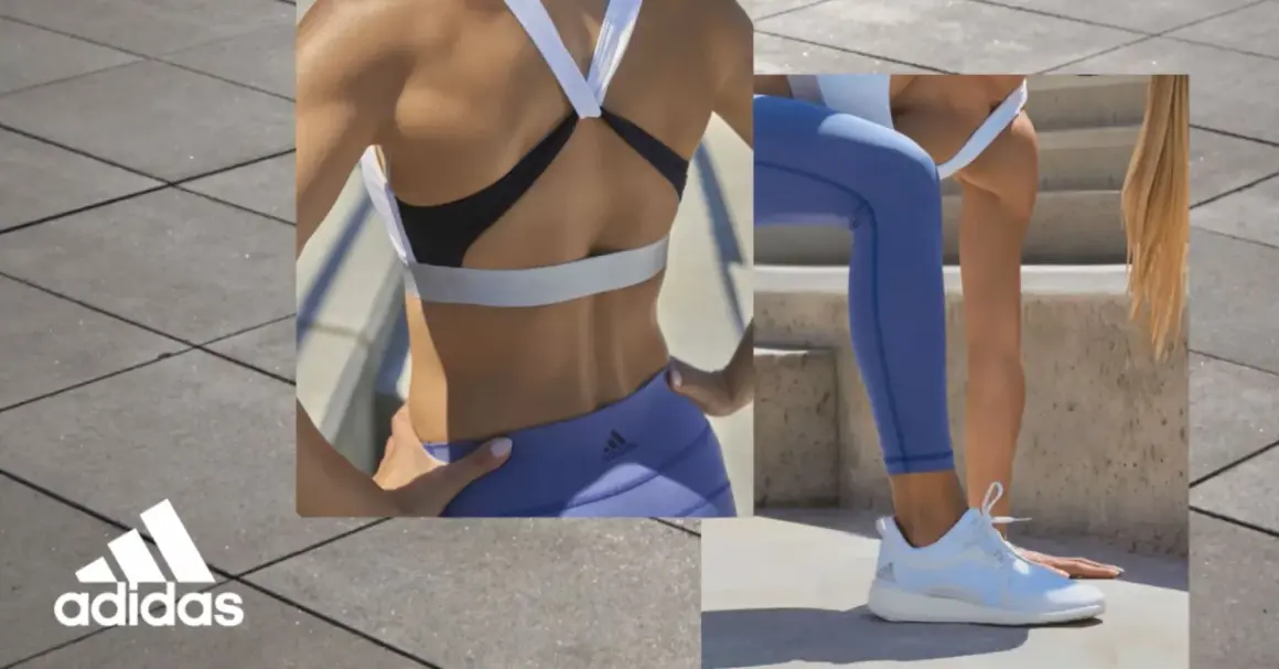 Kobieta w sportowym stroju, w tym bielizna adidas, ćwiczy na zewnątrz.