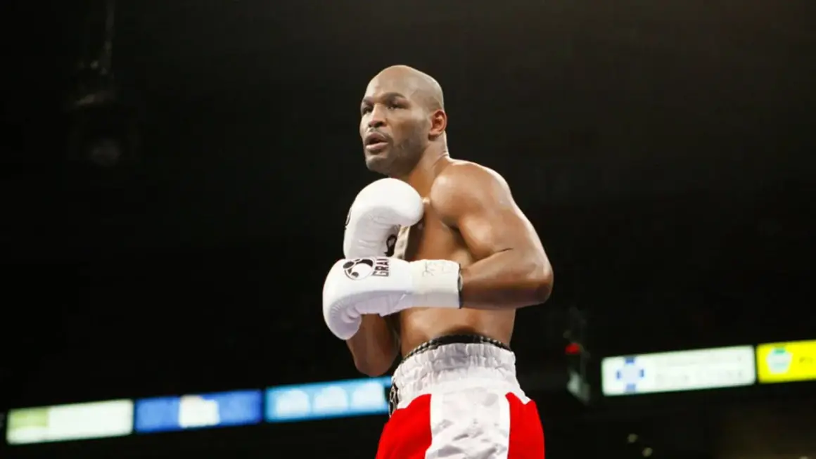 Bernard Hopkins training in the ring, focused and ready. His white gloves are a blur of motion as he prepares for his next fight.
