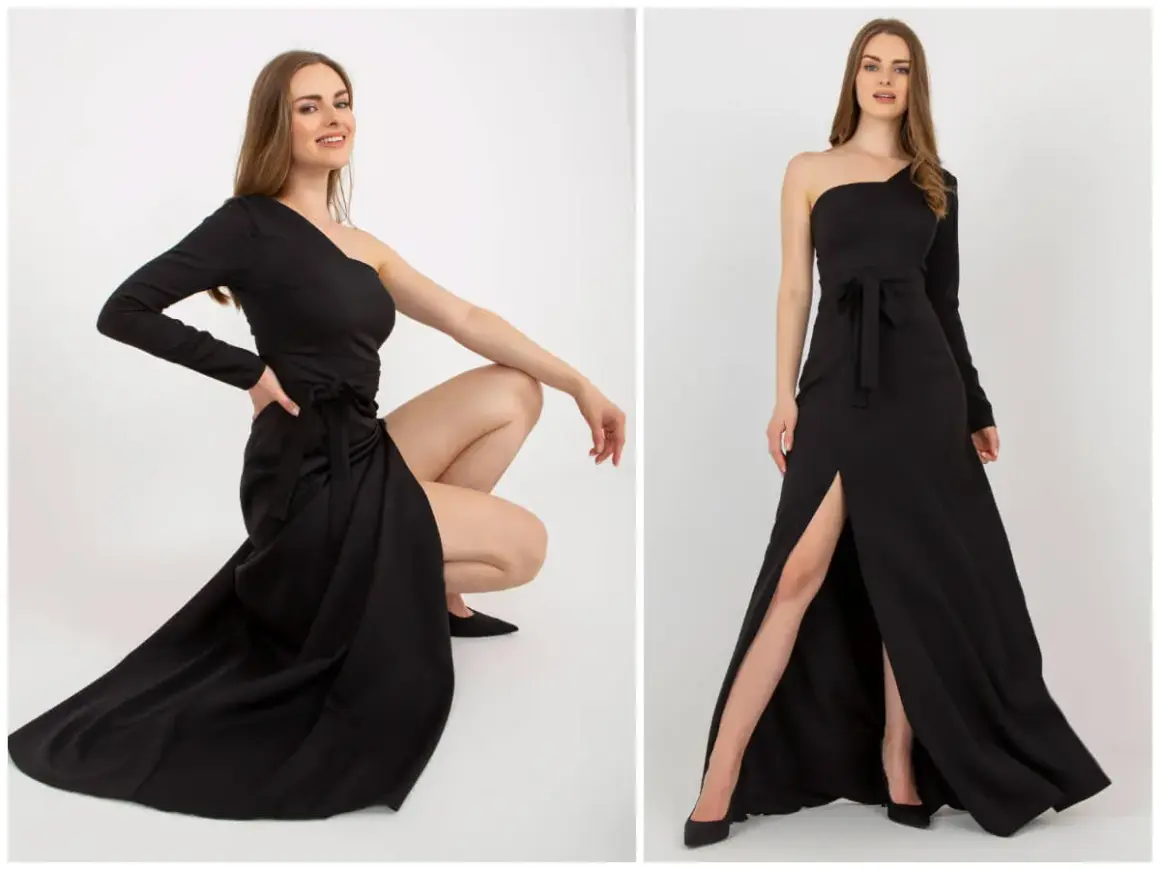 Elegancka, czarna sukienka wieczorowa z jednym rękawem i rozcięciem na nodze. Oryginalne sukienki wieczorowe dla każdej kobiety.