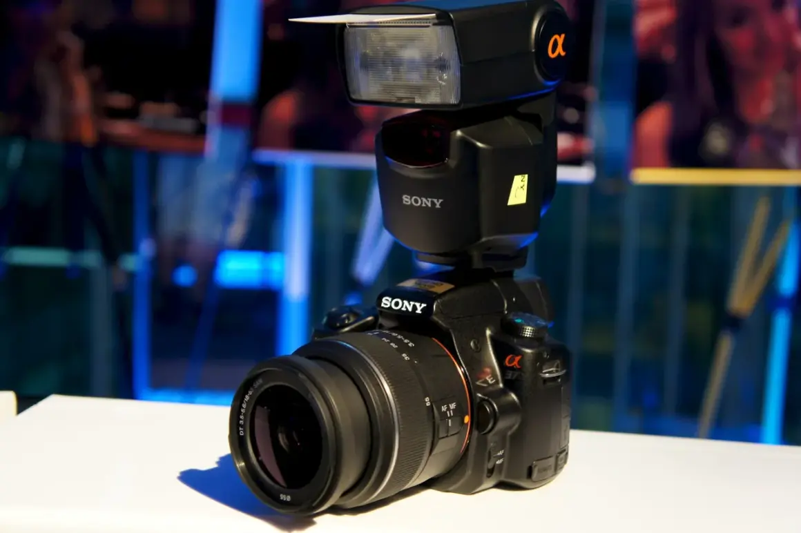 A Sony a37 camera with a flash unit attached, ready to capture any moment.