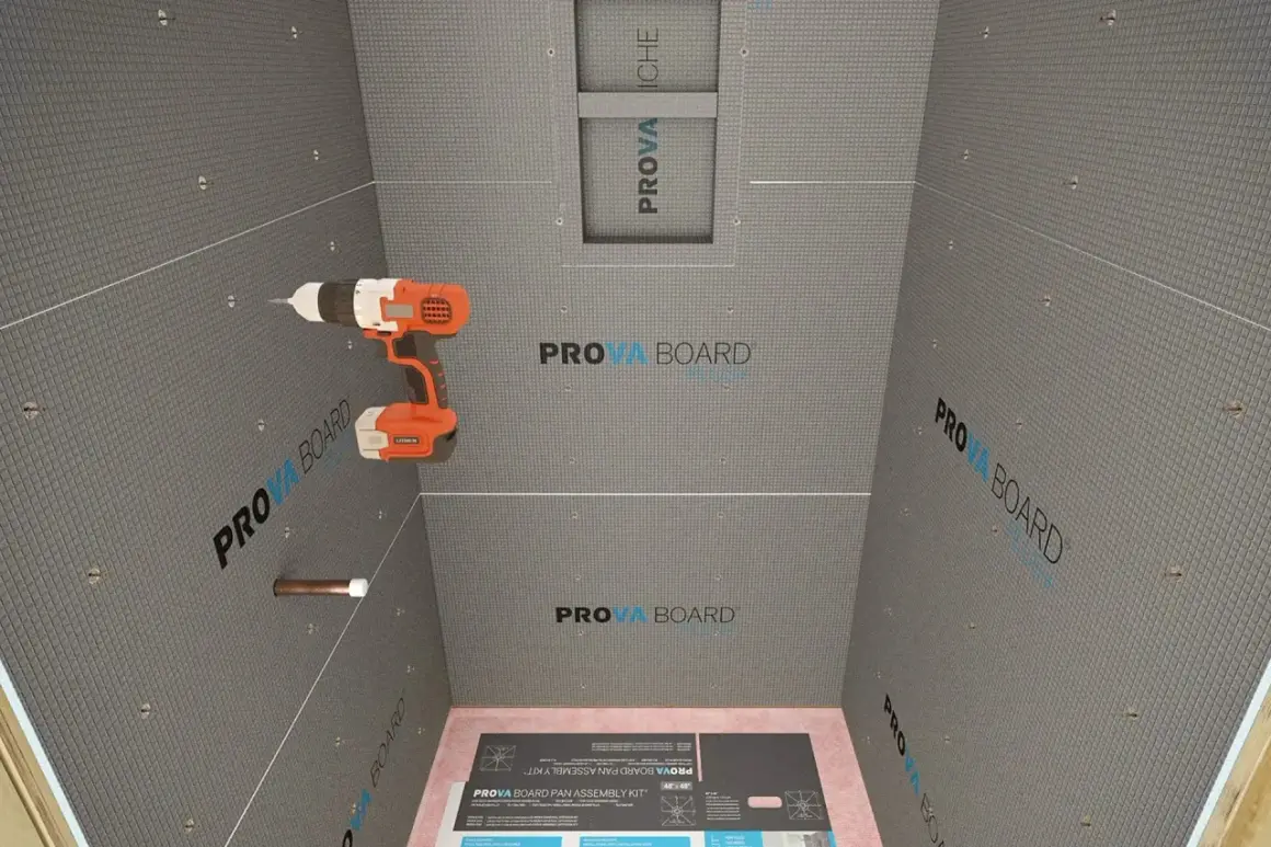 Drill in hand, ready to install concrete board for a shower. This image shows the process of how to install concrete board, with the PROVA BOARD brand visible.