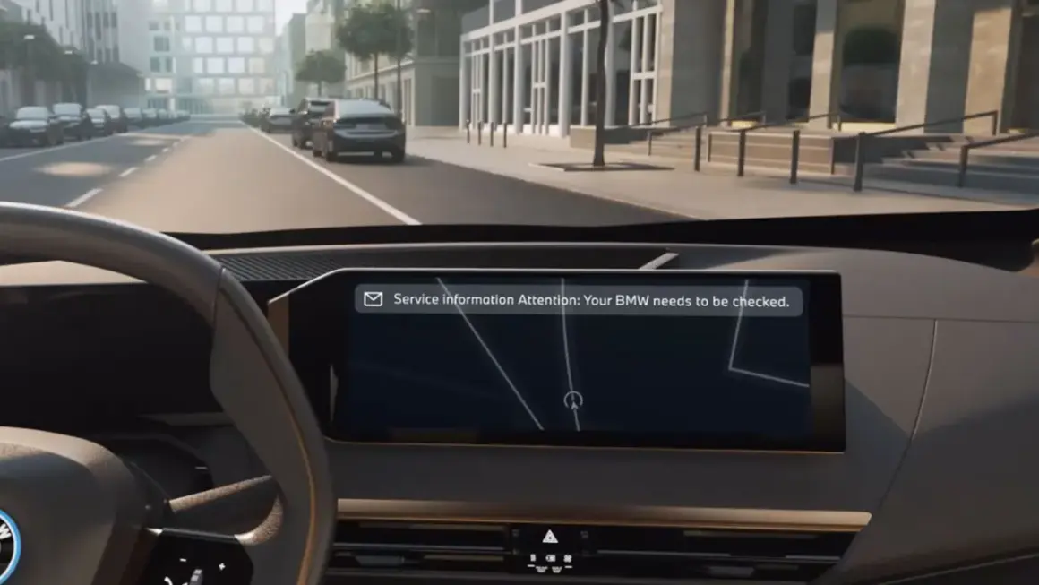 Vista interior de un BMW con mensaje de atención: "Tu BMW necesita una revisión".