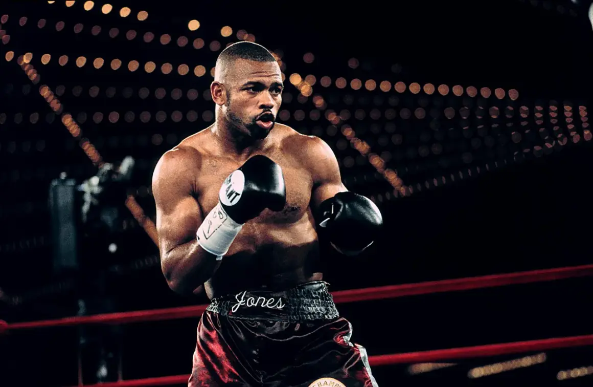 Roy Jones Jr. in the ring, ready for one of his best fights. His name is emblazoned on his shorts.