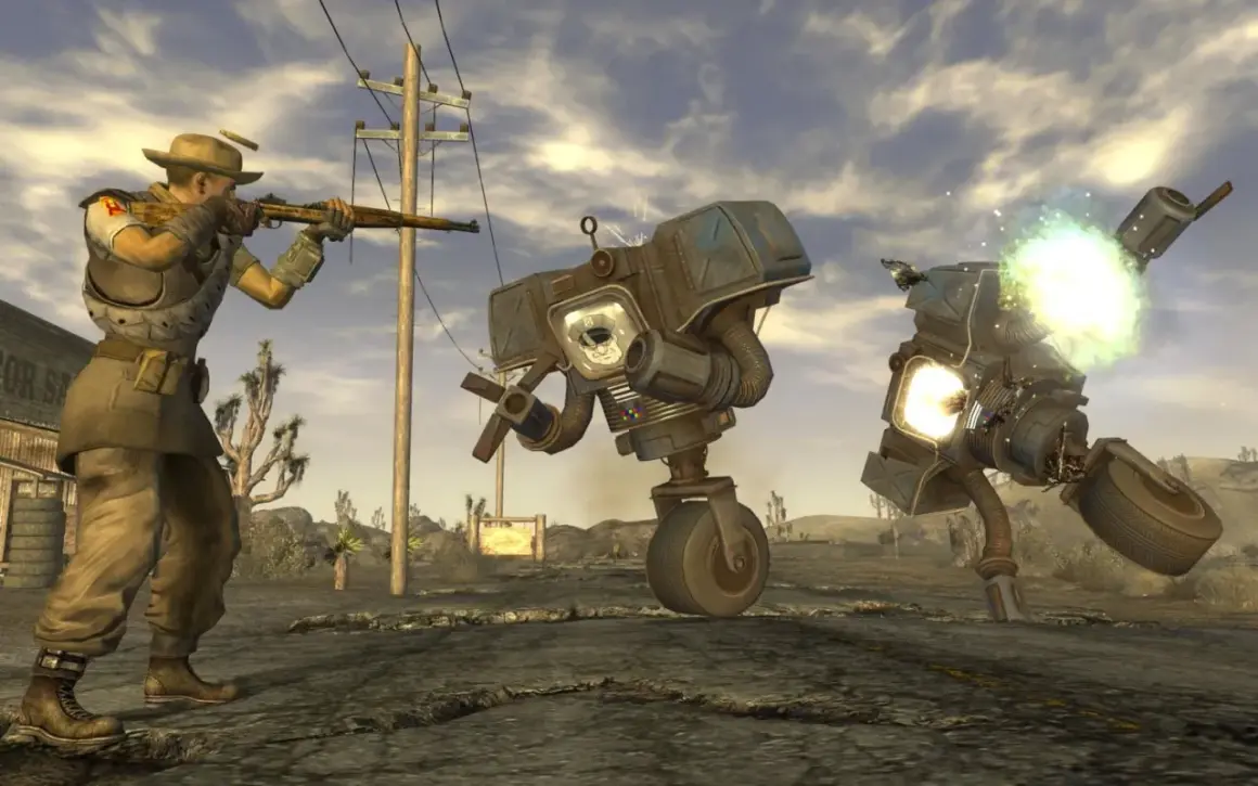 Gracz w kapeluszu strzela do robotów w pustynnym krajobrazie. To scena z najlepszej gry Fallout, pełnej akcji i postapokaliptycznych wyzwań.