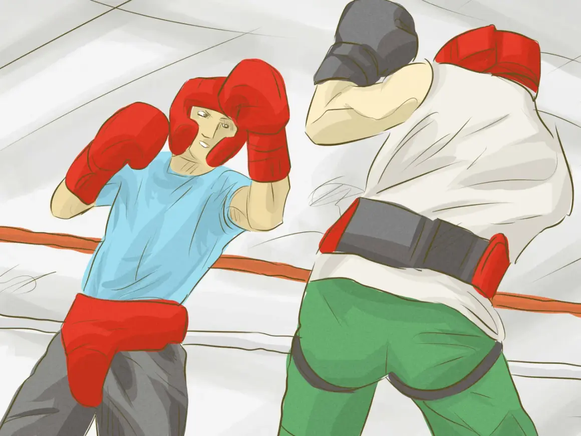 Two boxers in a ring, one in a blue shirt and red headgear, the other in a white shirt and grey cap, demonstrating how to box.