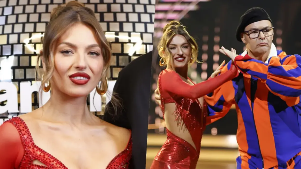 Izabela Skierska w czerwonej sukience tańczy z partnerem w stroju cyrkowym.
