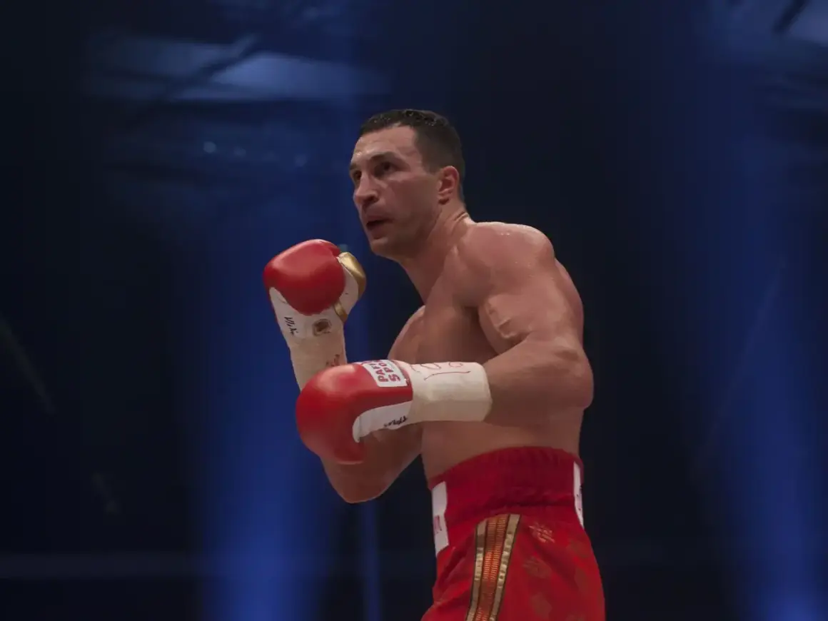Wladimir Klitschko in a boxing stance, his powerful reach evident as he prepares to strike.