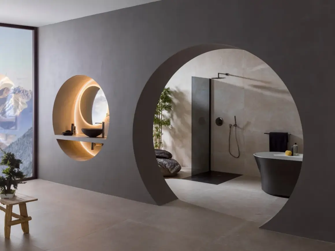Élégante salle de bain feng shui avec vasque ronde, douche moderne et baignoire îlot. L'espace invite à la sérénité.