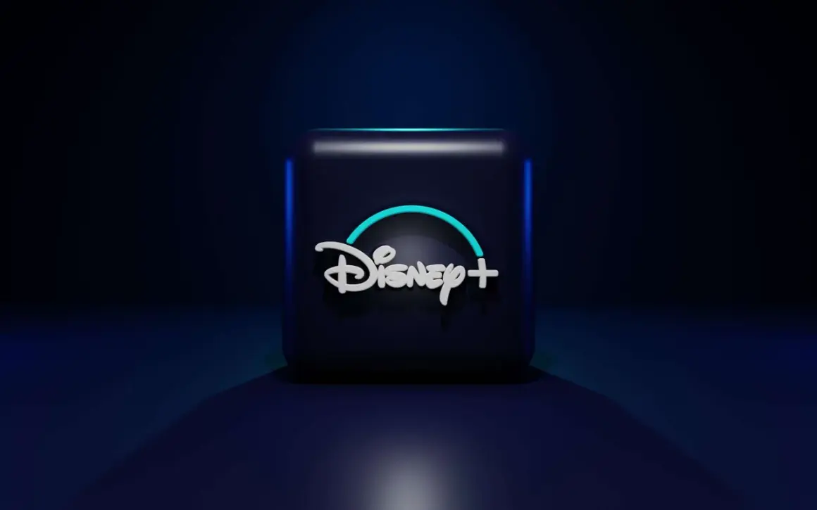 Ciemny sześcian z logo Disney+ w neonowym blasku. Idealny do wyboru **Disney Plus pakiety** dla całej rodziny.