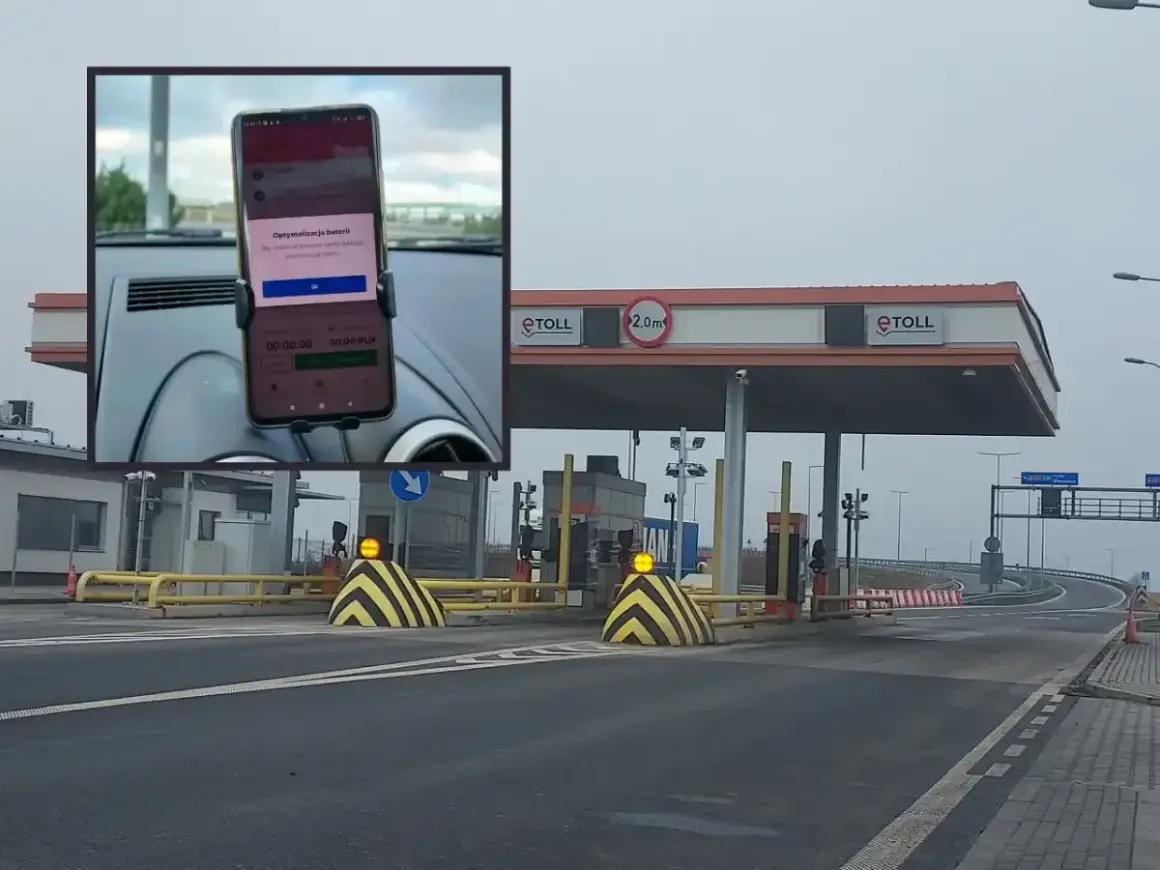 Telefon z aplikacją do opłat za autostradę A2 zamontowany w samochodzie przed bramkami e-TOLL.