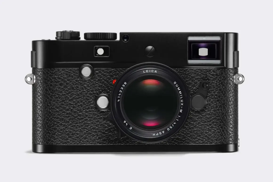 A classic black Leica 240 camera with a Summilux-M 50mm f/1.4 ASPH lens. This iconic camera is ready to capture timeless moments.