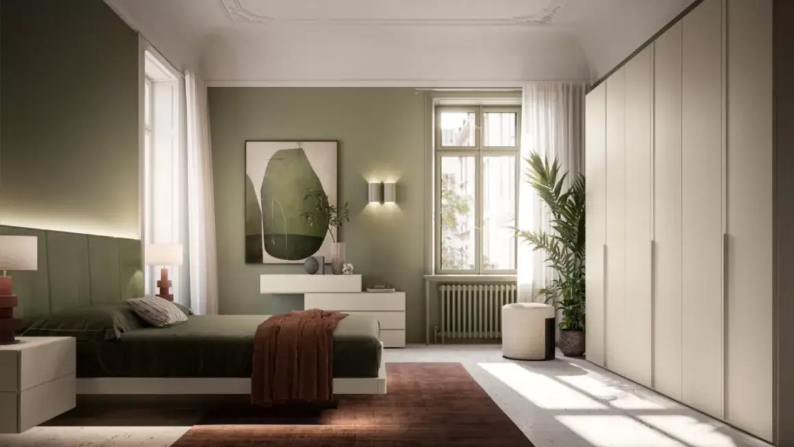 Camera da letto con un elegante abbinamento verde e tortora. Pareti verdi, letto con testiera imbottita, armadio tortora e un quadro astratto.