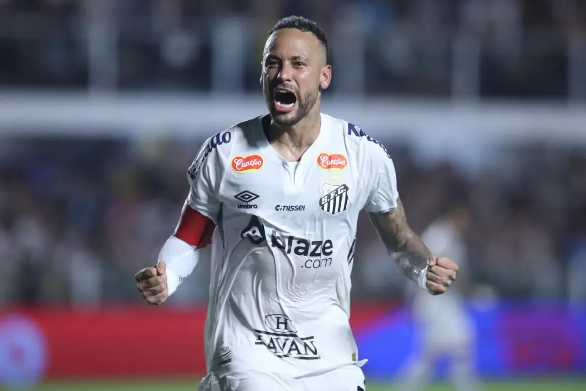 Neymar w białej koszulce Santos, krzyczy z radości. Jego zarobki robią wrażenie, ale to pasja do gry jest najważniejsza.