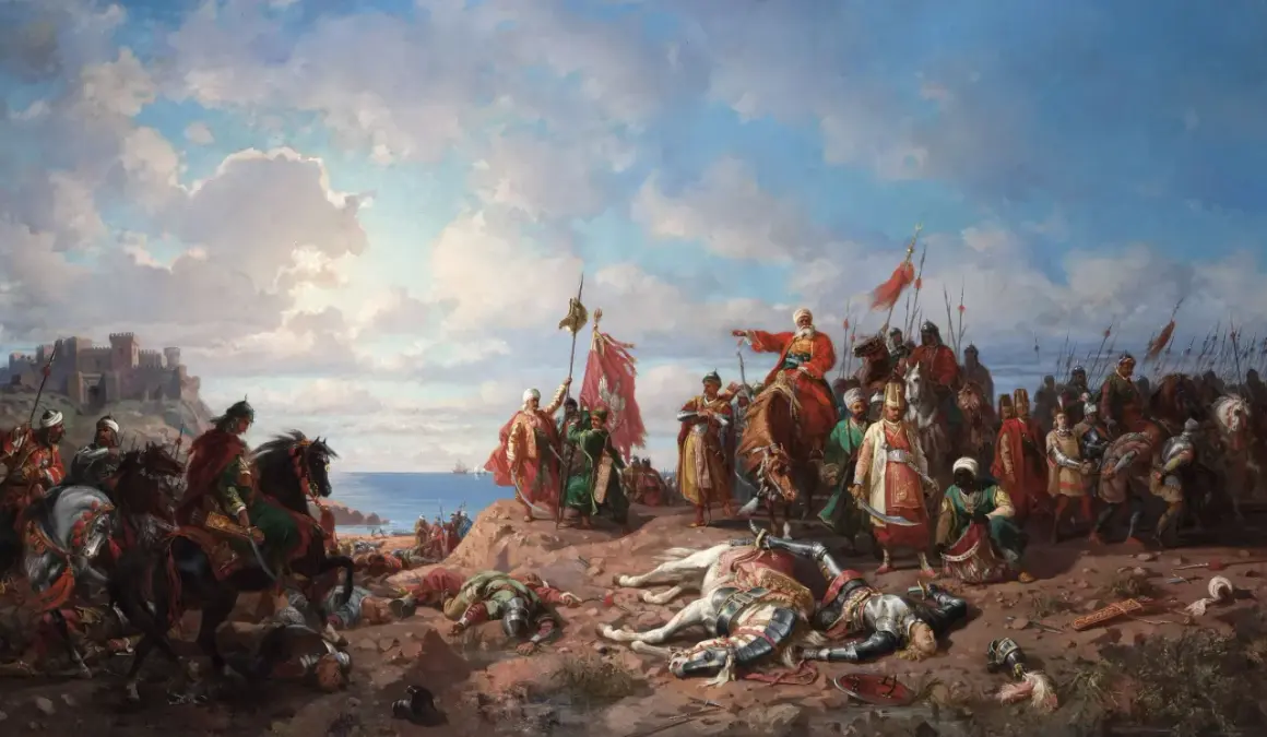 Soldados a caballo y a pie, con armaduras y estandartes, celebran una victoria en la costa. Un castillo se alza al fondo. Escena de la expansión del imperio otomano.