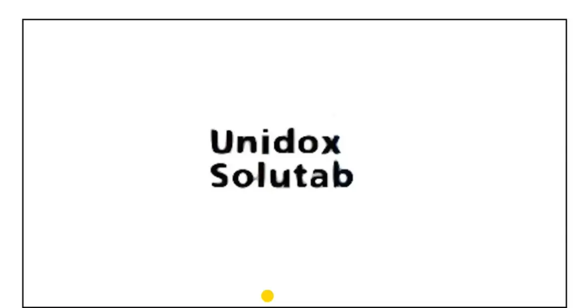 Napis "Unidox Solutab" na białym tle. Mały żółty okrąg na dole.