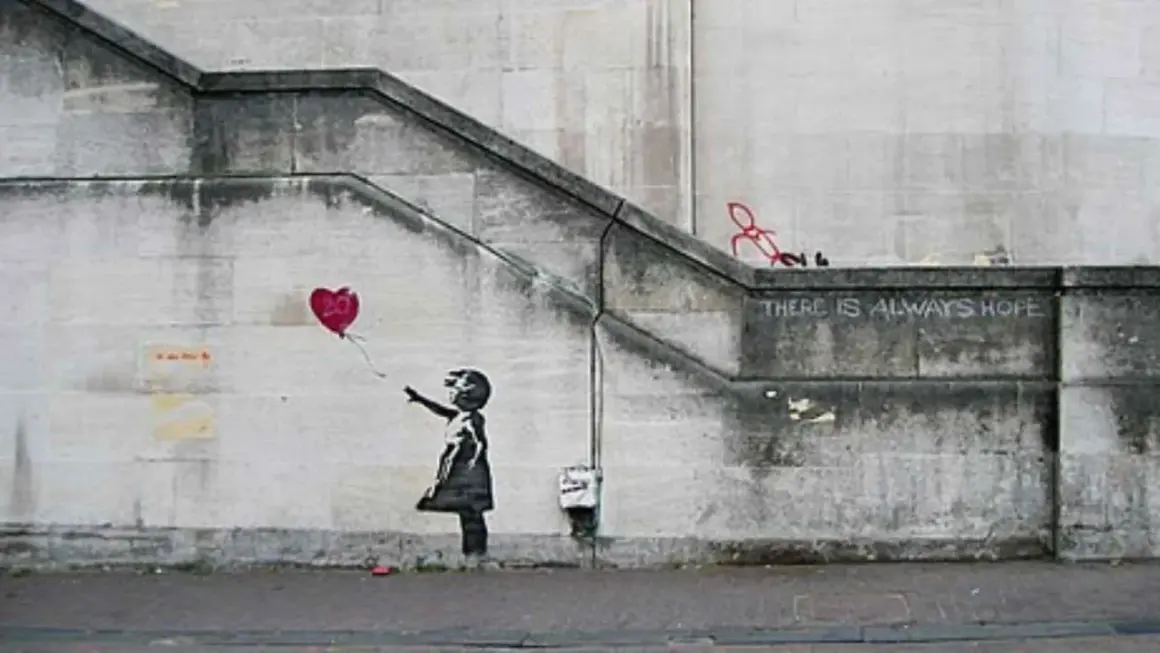 Banksy art piece: Girl letting go of a red heart balloon, with the words "THERE IS ALWAYS HOPE" stenciled above.