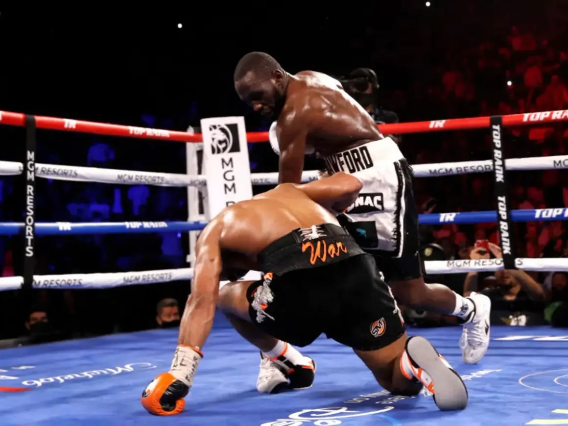 Terence Crawford, a southpaw, lands a powerful punch, sending his opponent to the canvas.