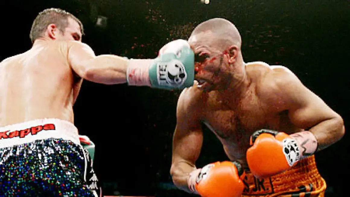 A boxer lands a punch on his opponent's face during the Joe Calzaghe vs Roy Jones Jr. fight.