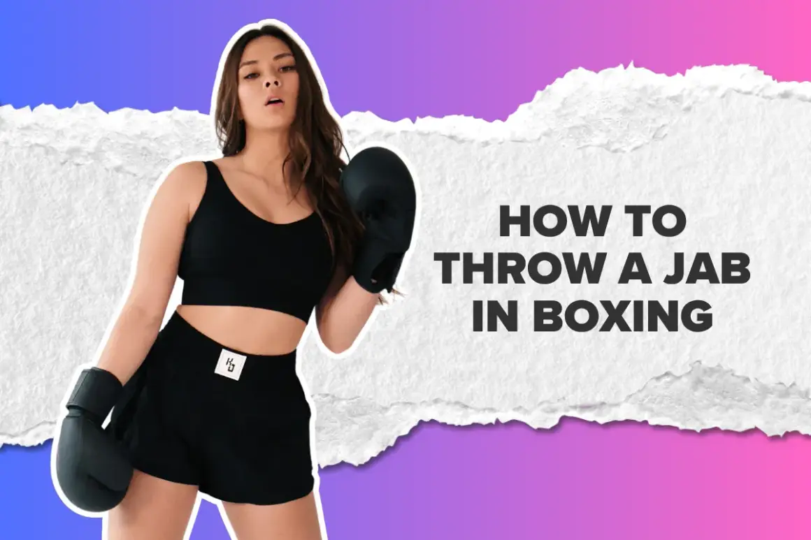A woman in boxing gloves demonstrates how to throw a jab in boxing.