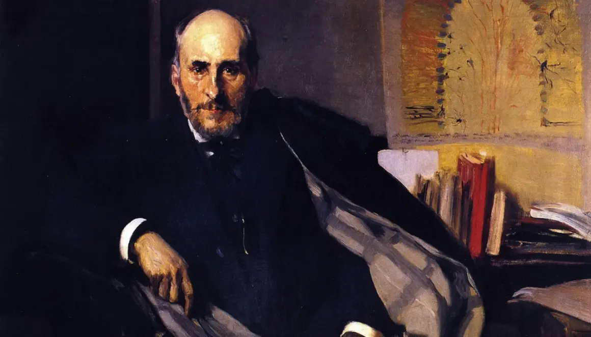 Retrato de Ramón de la Sagra, hombre de barba y traje oscuro, sentado con libros detrás.
