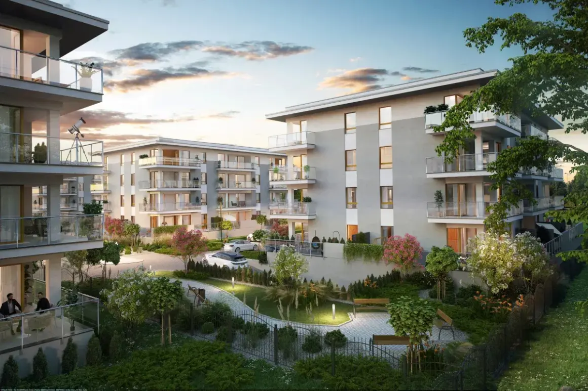 Nowoczesne mieszkania do wynajęcia Suwałki. Eleganckie apartamenty z balkonami, zielony dziedziniec, ławki, drzewa i krzewy.